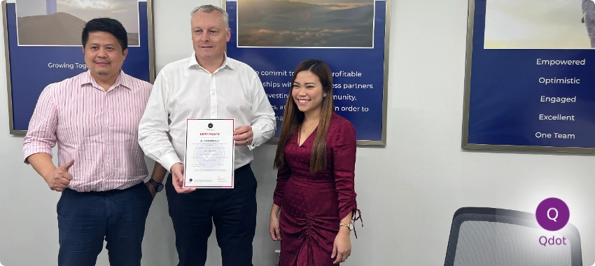 Al Masaood representatives holding ISO certificate after successful certification support by Qdot UAE