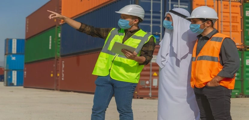 Safety inspection team reviewing workplace conditions at a UAE container yard during ISO 45001 audit