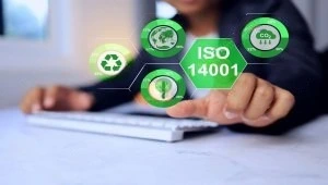 Businessman pointing to ISO 14001 environmental management concept for UAE companies.