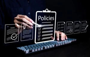 Business professional reviewing policy documents for ISO 9001 compliance and quality management requirements 